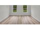 Bright bedroom featuring wood floors and windows at 357 Marion Oaks Pass, Ocala, FL 34473