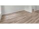 Bright, empty room features light wood-look floors and crisp white trim at 357 Marion Oaks Pass, Ocala, FL 34473