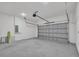 Spacious two-car garage with automatic door and concrete floor, ready for storage or workshop at 357 Marion Oaks Pass, Ocala, FL 34473