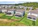 Aerial view of a home with a fenced yard and covered patio near lush greenery at 3961 Crawley Down Loop, Sanford, FL 32773