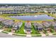 Stunning aerial view of the property with scenic pond and fountain in a well-planned community at 3961 Crawley Down Loop, Sanford, FL 32773