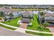 Aerial view of a home with lush landscaping, set on a picturesque lot with a pond at 3961 Crawley Down Loop, Sanford, FL 32773