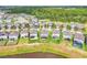Aerial view of a home's backyard with green lawn, fence, and scenic lake view, offering outdoor space at 3961 Crawley Down Loop, Sanford, FL 32773