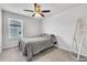 Cozy bedroom featuring a comfortable queen-sized bed, neutral tones, and a bright window for ample natural light at 3961 Crawley Down Loop, Sanford, FL 32773