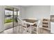 Sunlit dining area with views of the outdoor patio and lake at 3961 Crawley Down Loop, Sanford, FL 32773