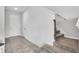 Inviting entryway with tile flooring leads to carpeted stairs, enhancing the home's entry appeal and design at 3961 Crawley Down Loop, Sanford, FL 32773