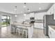 Modern kitchen featuring a granite island with seating, stainless steel appliances, and ample cabinet space at 3961 Crawley Down Loop, Sanford, FL 32773