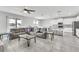 Spacious open-concept living area flowing into the modern kitchen, perfect for entertaining and Gathering gatherings at 3961 Crawley Down Loop, Sanford, FL 32773