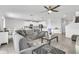 Open-concept living area with tile flooring, recessed lighting, and a seamless flow into the modern kitchen at 3961 Crawley Down Loop, Sanford, FL 32773