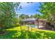 Backyard view of screened pool, landscaping, and fenced yard at 4218 Inwood Landing Dr, Orlando, FL 32812