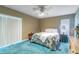 Bedroom with blue carpet, ceiling fan and lots of natural light from two windows at 4218 Inwood Landing Dr, Orlando, FL 32812