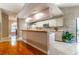 Bright kitchen with breakfast bar and view to dining area, perfect for casual meals and entertaining at 4218 Inwood Landing Dr, Orlando, FL 32812
