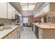 Functional kitchen with lots of cabinets and counter space and a view of the dining area at 4218 Inwood Landing Dr, Orlando, FL 32812