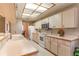 Spacious kitchen with stainless steel appliances and a breakfast bar, perfect for casual dining at 4218 Inwood Landing Dr, Orlando, FL 32812