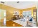 Spacious living room with hardwood floors and a view of the backyard pool at 4218 Inwood Landing Dr, Orlando, FL 32812