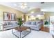 Bright living room featuring comfortable sofas and a large window providing natural light at 4218 Inwood Landing Dr, Orlando, FL 32812