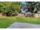 Well-maintained backyard featuring a large grass area and a wood fence at 4265 Old Colony Rd, Mulberry, FL 33860