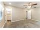 Neutral bedroom with carpet and view of bathroom featuring a single sink and vanity at 4265 Old Colony Rd, Mulberry, FL 33860