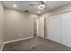 Bedroom featuring neutral walls, carpet, ceiling fan, and closet at 4265 Old Colony Rd, Mulberry, FL 33860