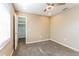 Bedroom featuring neutral walls, carpet, ceiling fan, and walk in closet at 4265 Old Colony Rd, Mulberry, FL 33860