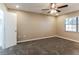 Bedroom featuring neutral walls, carpet, ceiling fan, and natural light from the window at 4265 Old Colony Rd, Mulberry, FL 33860