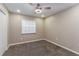 Bedroom featuring neutral walls, carpet, ceiling fan, and natural light from the window at 4265 Old Colony Rd, Mulberry, FL 33860