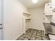 Laundry room with tiled flooring, cabinet, and shelving at 4265 Old Colony Rd, Mulberry, FL 33860