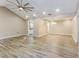 Open-concept living room boasting wood-look floors, ample natural light, and neutral wall color at 4265 Old Colony Rd, Mulberry, FL 33860