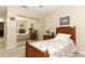 Well-lit bedroom featuring a mirrored closet, natural light, and wooden furniture at 474 Windmeadows St # 0, Altamonte Springs, FL 32701