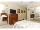 Bright bedroom with mirrored closet, natural light, and floral pattern bedding at 474 Windmeadows St # 0, Altamonte Springs, FL 32701