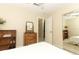 Cozy bedroom with white bedding, mirrored closet, natural light, and wooden dresser at 474 Windmeadows St # 0, Altamonte Springs, FL 32701