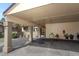Beige home exterior showcasing a convenient carport, potted plants along the walkway, and a secure gated entrance at 474 Windmeadows St # 0, Altamonte Springs, FL 32701
