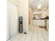 Hallway with tile flooring leading to the kitchen, offering a clean and open feel at 474 Windmeadows St # 0, Altamonte Springs, FL 32701