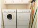 Convenient laundry room with washer and dryer, plus storage space at 474 Windmeadows St # 0, Altamonte Springs, FL 32701