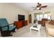 Cozy living room featuring a TV, comfortable seating, and ample natural light at 474 Windmeadows St # 0, Altamonte Springs, FL 32701