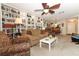 Spacious living room with built-in bookshelves, open layout and view to kitchen and dining area at 474 Windmeadows St # 0, Altamonte Springs, FL 32701