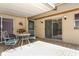 Inviting brick patio featuring a metal table with chairs and sliding glass doors for easy indoor-outdoor access at 474 Windmeadows St # 0, Altamonte Springs, FL 32701