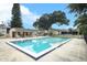A community swimming pool with a covered area and several chairs for relaxing by the pool at 474 Windmeadows St # 0, Altamonte Springs, FL 32701