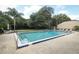 A community swimming pool with a ladder and a chair area available for relaxing and sunbathing at 474 Windmeadows St # 0, Altamonte Springs, FL 32701