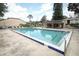 Community swimming pool with clear blue water featuring a clubhouse and chairs in the pool area at 474 Windmeadows St # 0, Altamonte Springs, FL 32701
