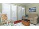 Cozy sun room with a rocking chair, comfortable seating, and serene views at 474 Windmeadows St # 0, Altamonte Springs, FL 32701
