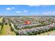 Aerial view of property in a well developed neighborhood with a red arrow pointing to the home at 480 Lasso Dr, Kissimmee, FL 34747