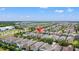 Overhead aerial shot of a Gathering-friendly residential area showing community homes, green spaces, and commercial businesses at 480 Lasso Dr, Kissimmee, FL 34747