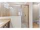 This full bathroom features a glass walk-in shower and granite countertops at 480 Lasso Dr, Kissimmee, FL 34747