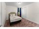 Bedroom with soft carpet, neutral walls, queen bed, closet, and natural light from a window at 480 Lasso Dr, Kissimmee, FL 34747