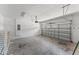 Spacious two car garage with automatic door and white brick walls at 480 Lasso Dr, Kissimmee, FL 34747