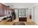 Modern kitchen with granite countertops, stainless steel appliances, and dark wood cabinets at 480 Lasso Dr, Kissimmee, FL 34747