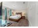 Cozy primary bedroom features a large bed, carpeted floor, and soft natural light at 480 Lasso Dr, Kissimmee, FL 34747