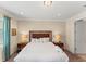 The primary bedroom features a king bed, bedside lamps, and neutral paint at 480 Lasso Dr, Kissimmee, FL 34747