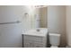 Clean bathroom featuring a classic vanity with a mirror and a white toilet at 4827 Elese St, Orlando, FL 32811